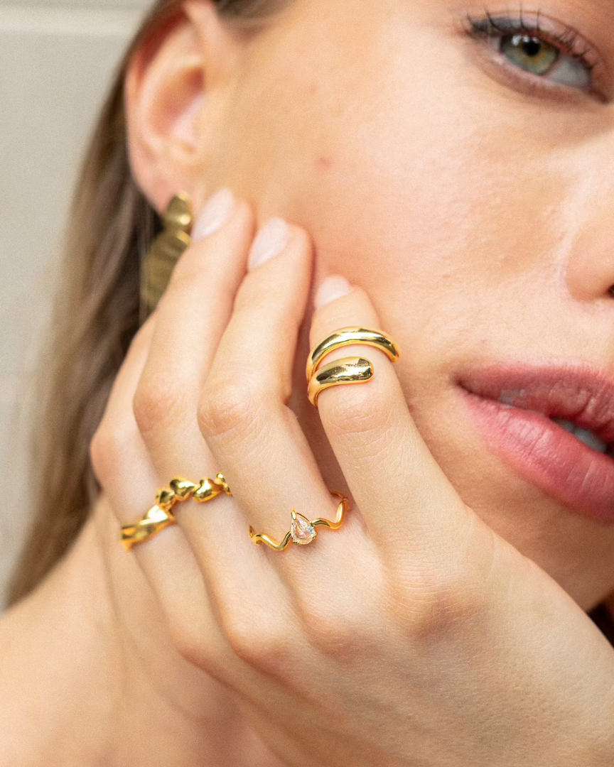 Model wearing stackable gold rings by Mila Online Shop, Melbourne, Australia