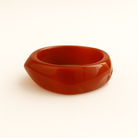 Close up of terra coloured MA-FRIENDS RESIN BANGLE