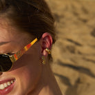 Gold Meg Ear Cuff styled with other earrings