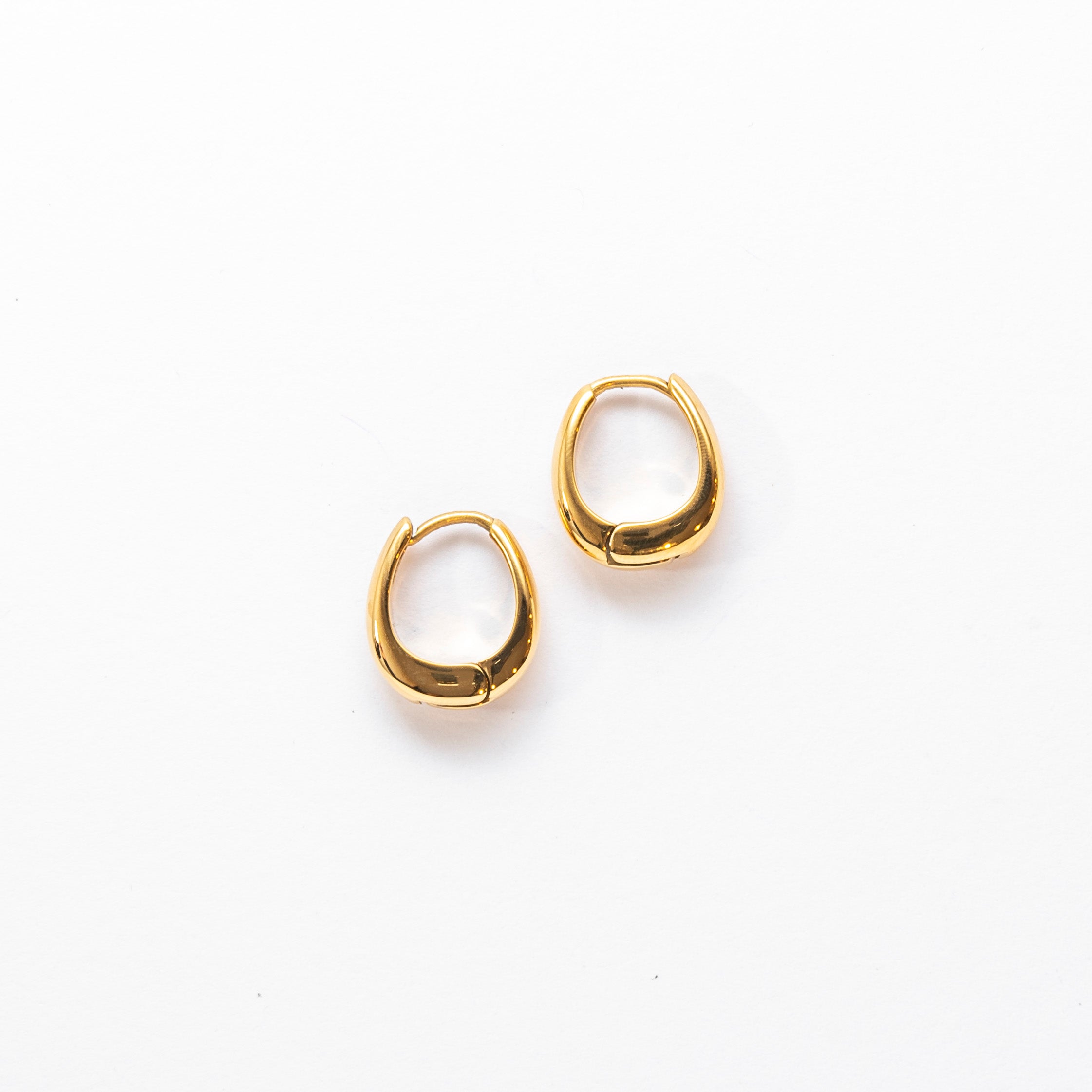 Close up of gold Dainty Huggie Classic Hoop Earrings by Mila Online Shop. Elegant and minimalist hoop earrings Australia, perfect for daily wear and stacking.
