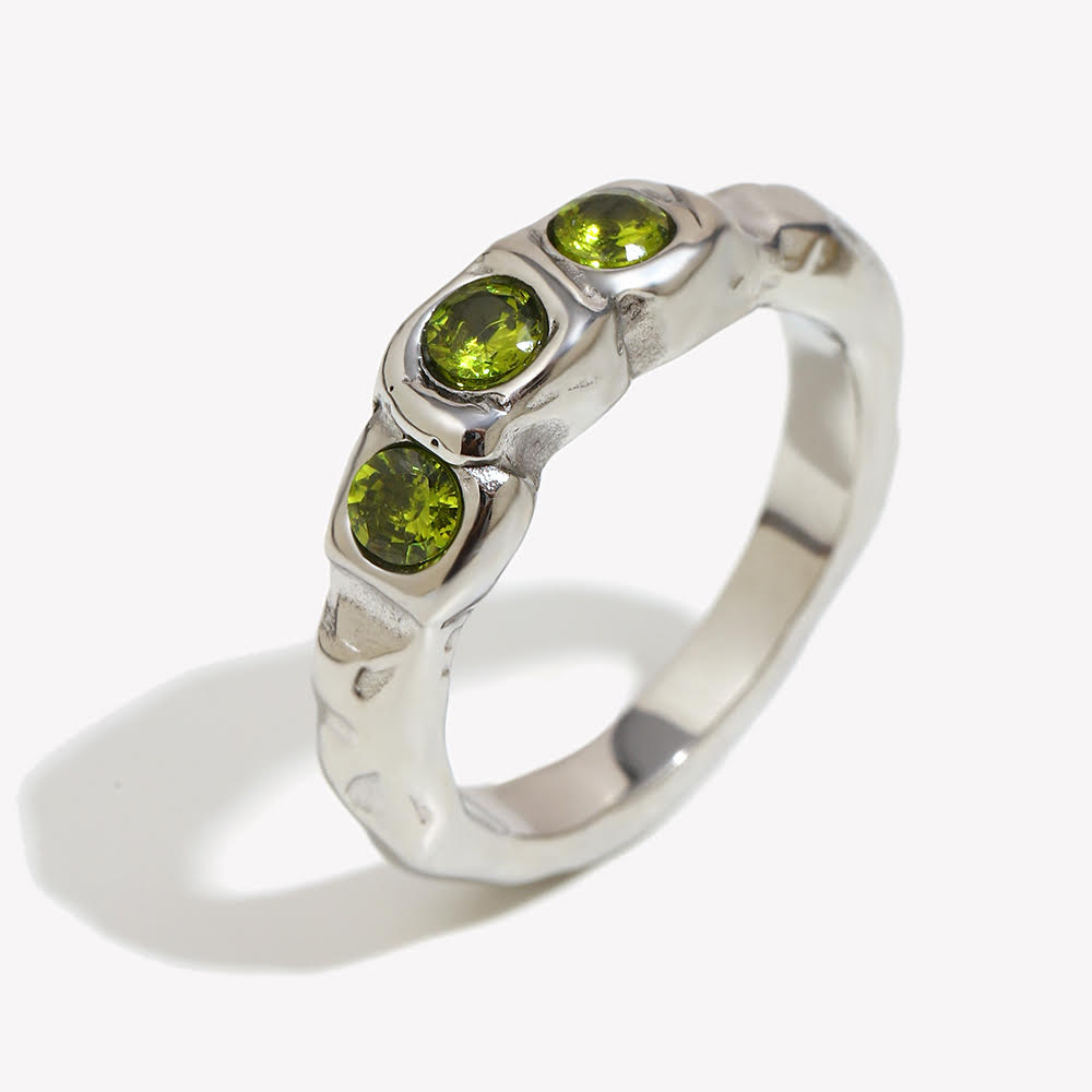 Close up of Mila Online Shop Amalfi Ring in silver featuring three layered green gemstones, elegant chunky ring paired with gemstone rings for stacking.