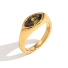 Close up of Mila Online Shop Millie Zirconia Cubic Ring with brilliant green zirconia stone in gold, stylish gemstone statement ring for stacking.