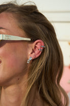 Model wearing silver Mini Maria Stud Earrings paired with ear cuffs – elegant little stud earrings designed for effortless style by Mila Online Shop.